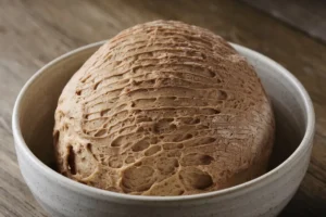 Discarding sourdough starter to maintain a healthy, active microbial balance and using sourdough discard in various recipes.