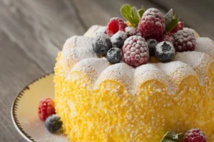 A delicious French gâteau on a rustic wooden table, highlighting the cultural significance of cakes in French cuisine.