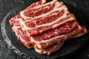 Crispy beef bacon strips cooked using different methods showcasing rich texture and smoky flavor.

