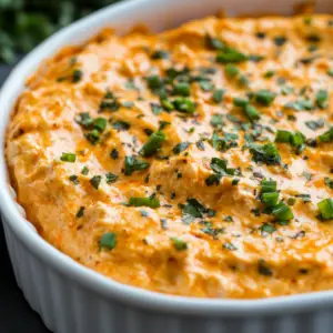 How do you make buffalo chicken dip not runny? 2 Thick and creamy buffalo chicken dip in a bowl served with celery and tortilla chips