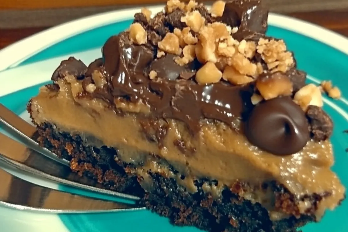 German Chocolate Poke Cake with coconut-pecan frosting and chocolate ganache on top