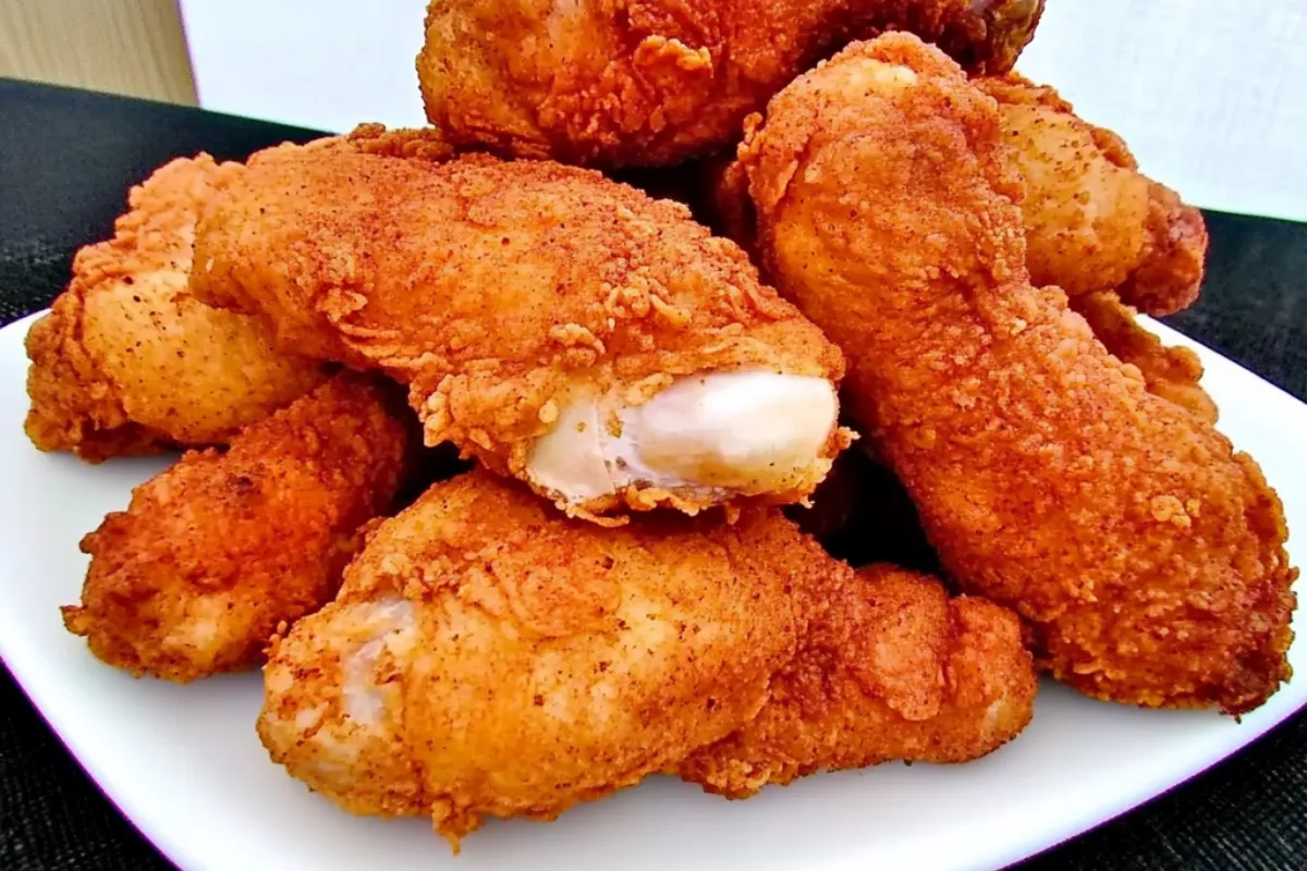 Crispy and golden-brown Popeye's CopyCat fried chicken with a spicy Cajun seasoning crust and juicy interior.