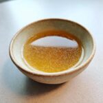 Close-up of a bowl filled with homemade fish broth, perfect for a Fish Broth Cat Recipe.
