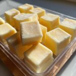 Close-up of a tray filled with homemade frozen cat treats, perfect for hot weather.