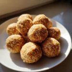Close-up of a plate with several No-Bake Cat Treat Balls, perfect for a feline snack.