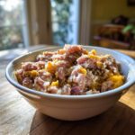Close-up of a bowl filled with a homemade Raw Protein Cat Meal, showing meat and vegetables.