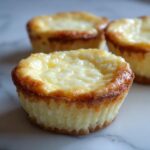 Close-up of baked Viral Two-Ingredient Cheesecake Cups, golden brown and delicious.