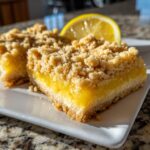 Close-up of delicious Lemon Crumb Bars, a sweet treat with a crumb topping and lemon filling.