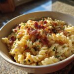 Close-up of pasta salad bacon ranch in a bowl, showing pasta, bacon, and creamy dressing.