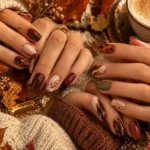 Chic fall nail trends for 2026 featuring chocolate, burgundy, olive, caramel, nude, and metallic designs.