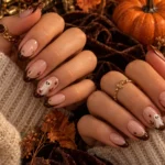 Brown ghost French tip Halloween nails with a chic fall manicure