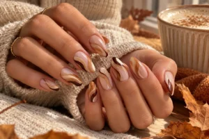 Chocolate brown French tip nails with a neutral base for early fall.